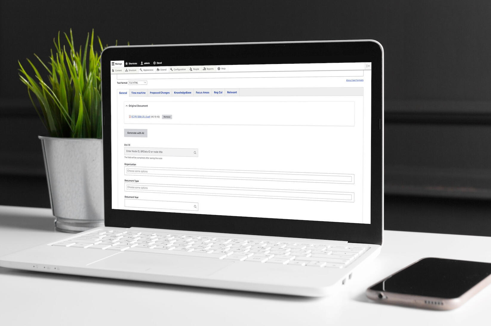 Laptop z ekranem, na którym wyświetla się panel Drupala i opcja generowania z AI dla redaktorów BetterRegulation.